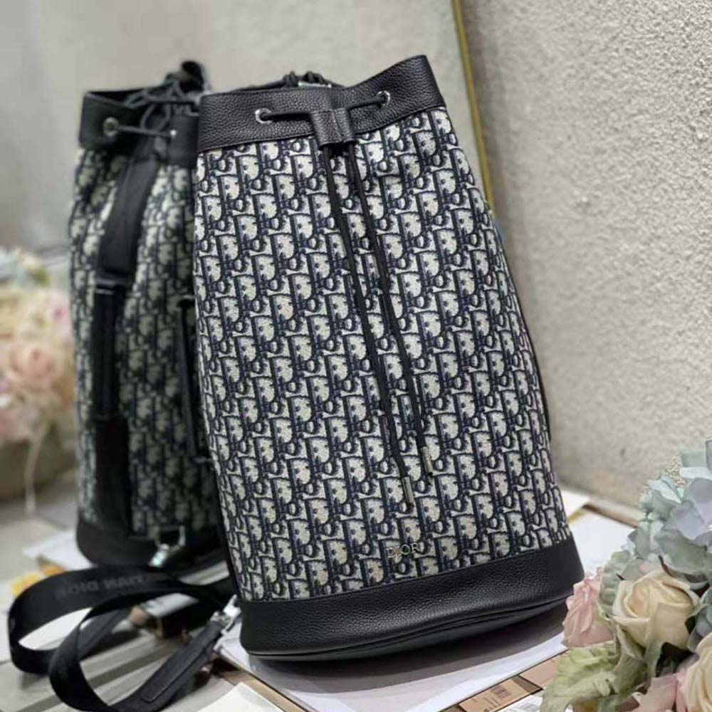 Close-up of Dior Oblique jacquard fabric and silver hardware on backpack