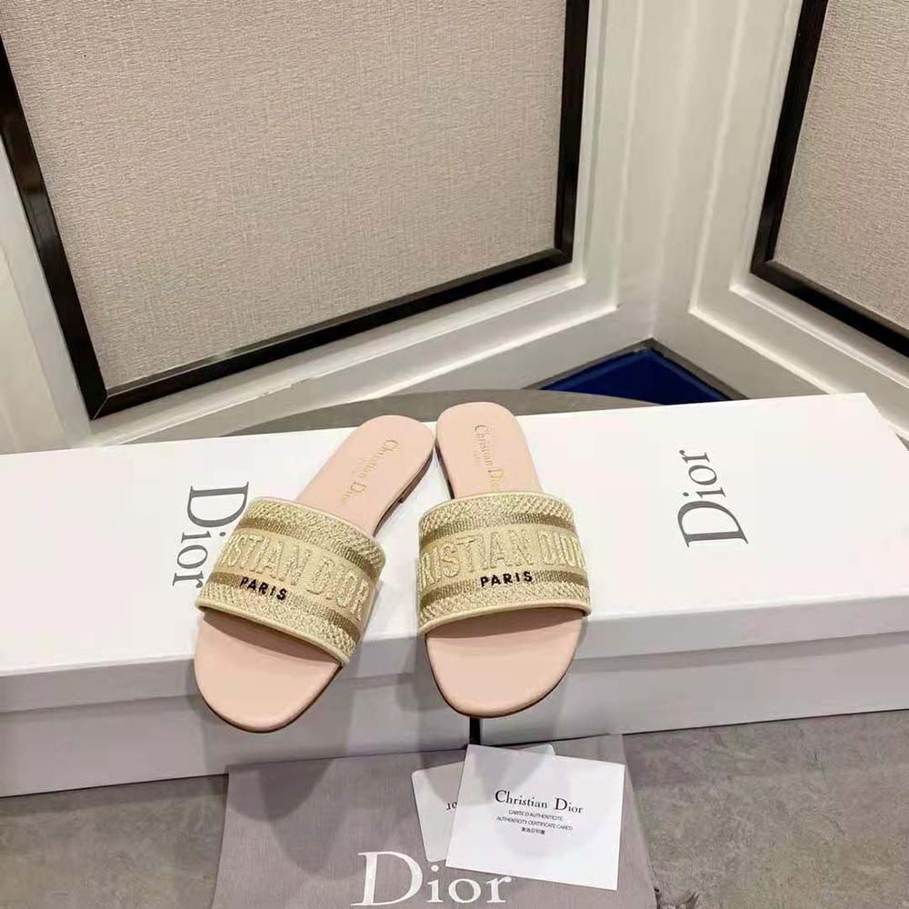 Close-up detail of gold-tone metallic embroidery on Dior Women Dway Slide sandal