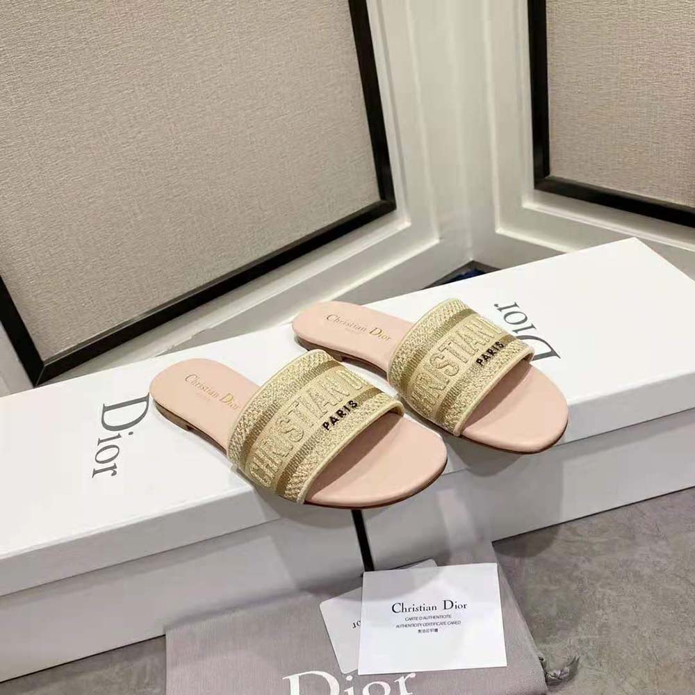 Side view showing soft pink cotton and slide silhouette of Dior Women Dway Slide
