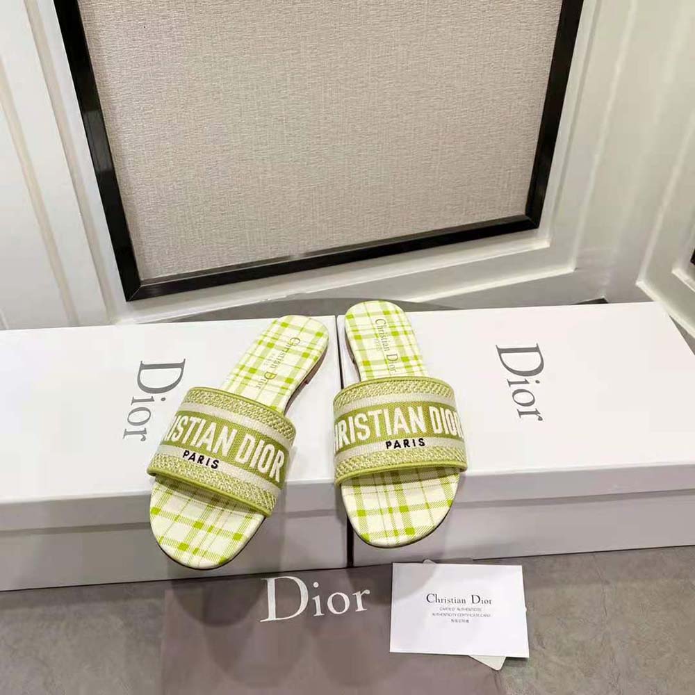 Close-up of lime check and Dior embroidery on slide strap