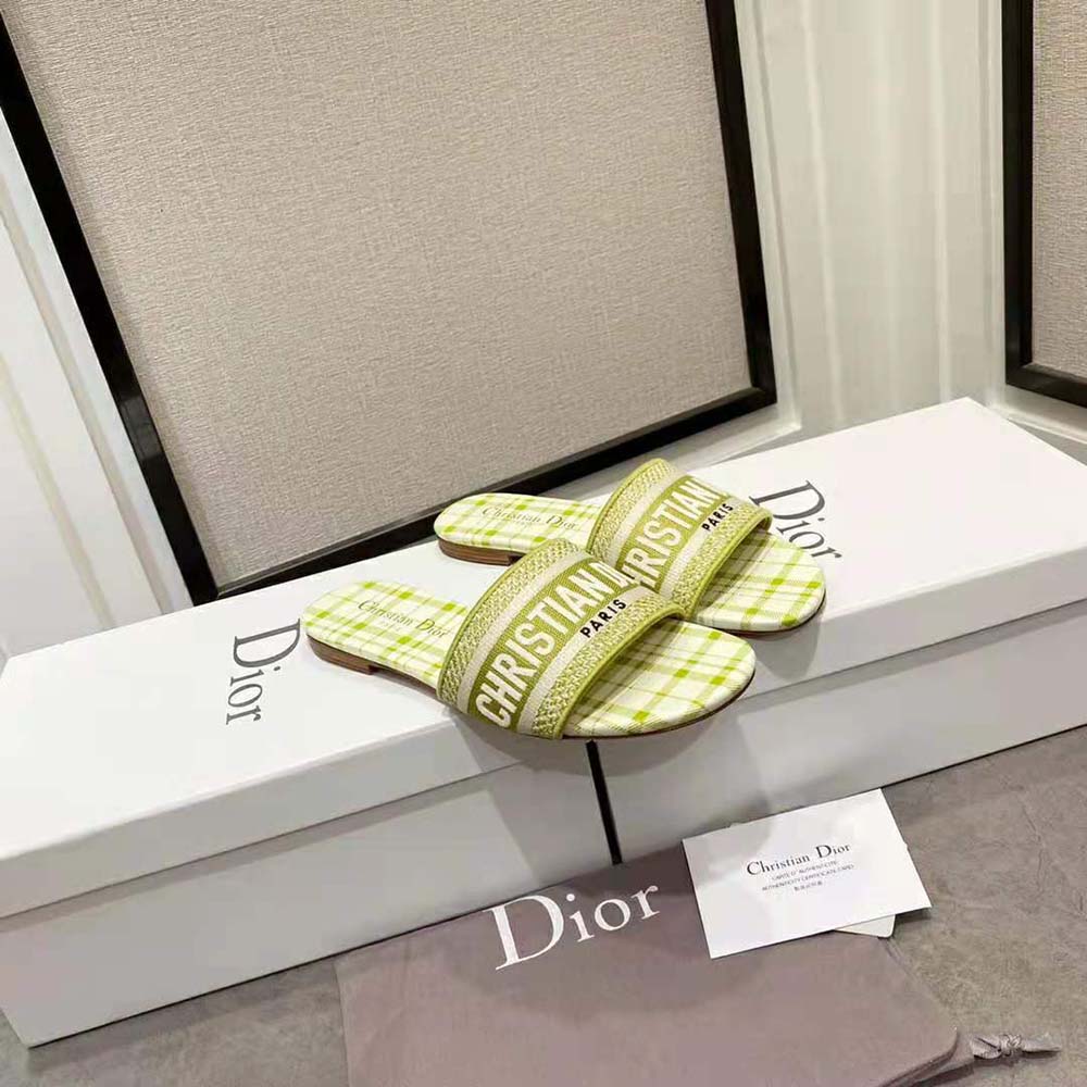 Top angle showing embroidered cotton upper and flat sole detail