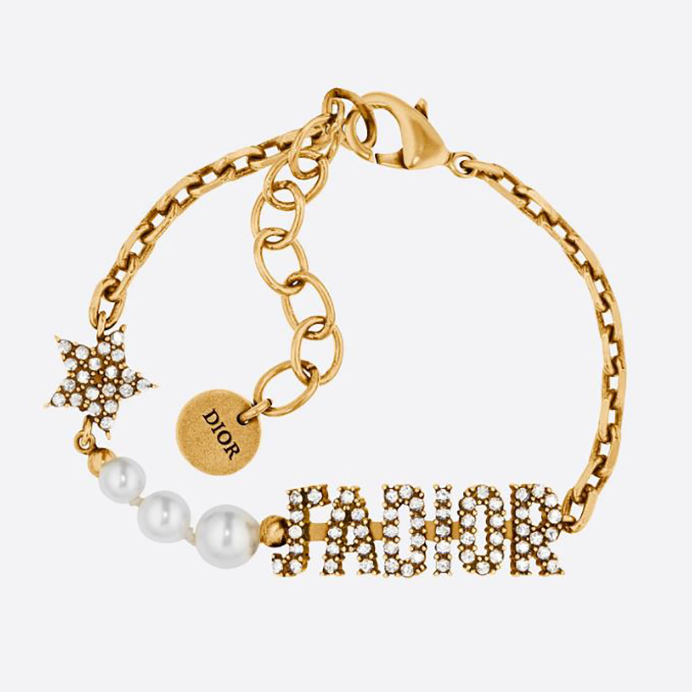 Close-up of Dior Women J’Adior Bracelet antique gold logo detail