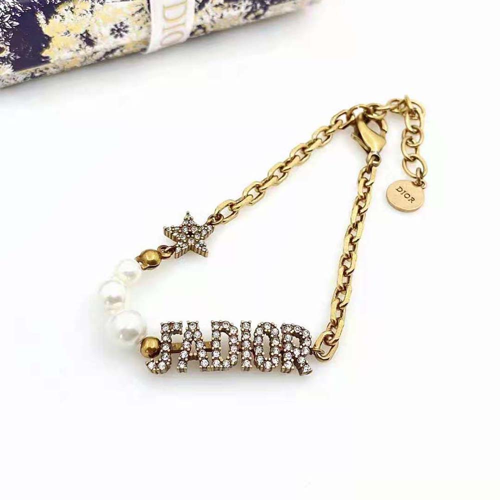 Side angle showing clasp of Dior Women J’Adior Bracelet in antique gold