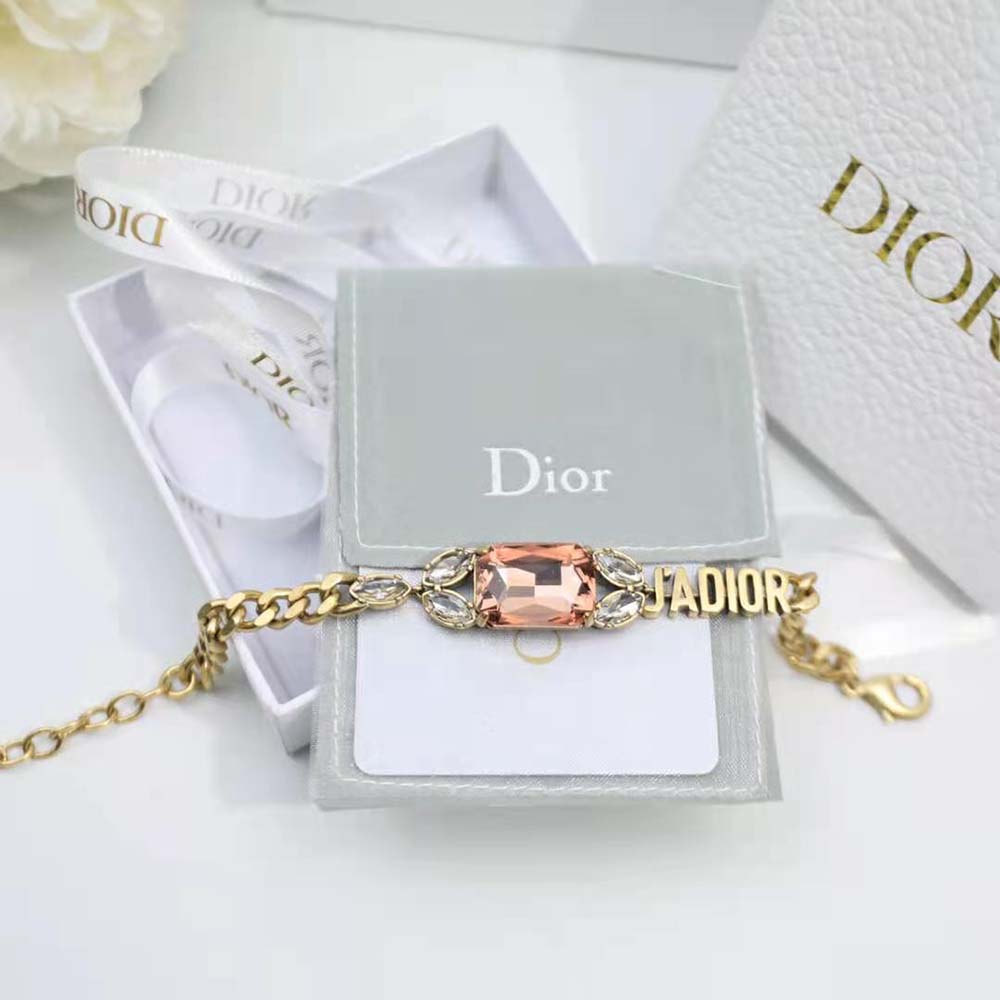 Styled wrist shot featuring Dior Women J’Adior Bracelet with pink crystal details