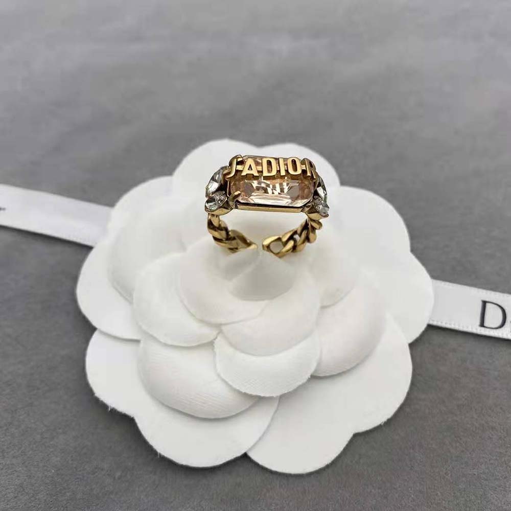Close-up on multicolor crystals of Dior Women J’Adior Ring in antique gold finish