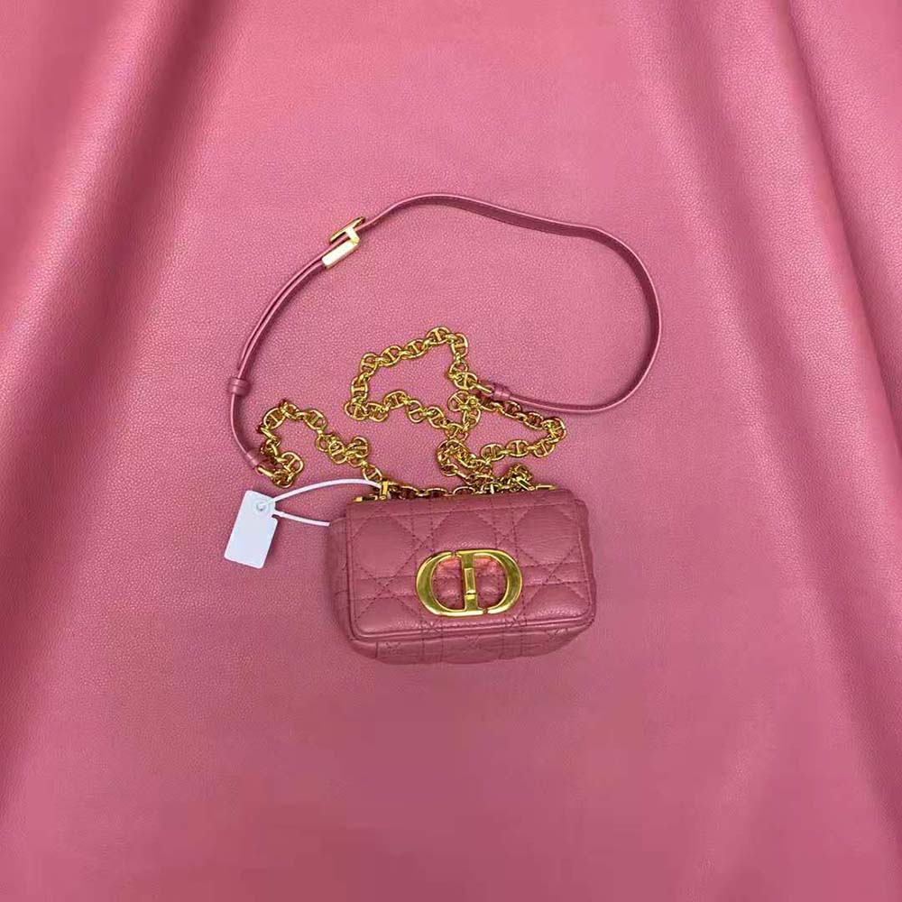 Close-up of gold Dior ‘Caro’ hardware on pink cannage leather bag