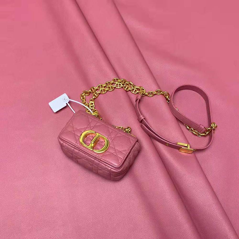 Side angle showing compact silhouette and chain strap of Micro Dior Caro Bag