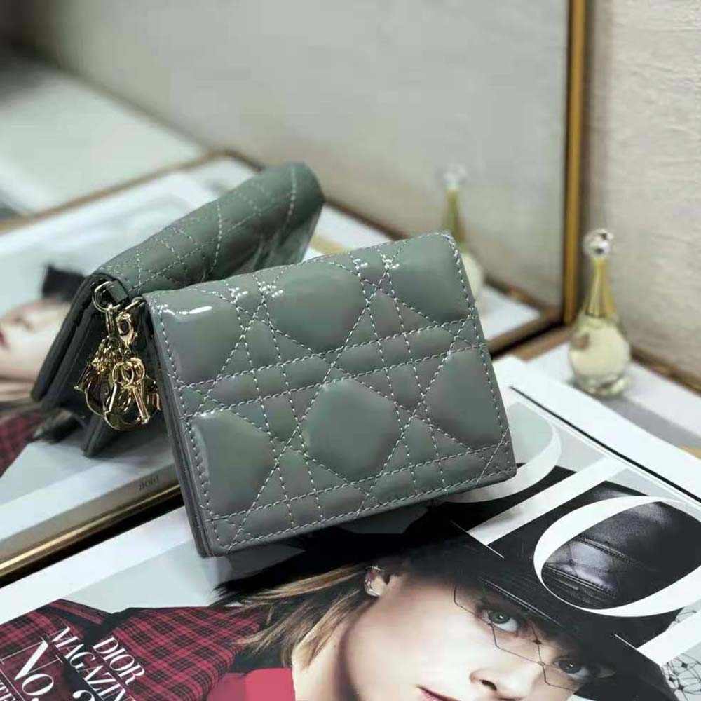 Close-up on silver hardware and signature Cannage quilting of Dior Women Mini Lady Dior Wallet
