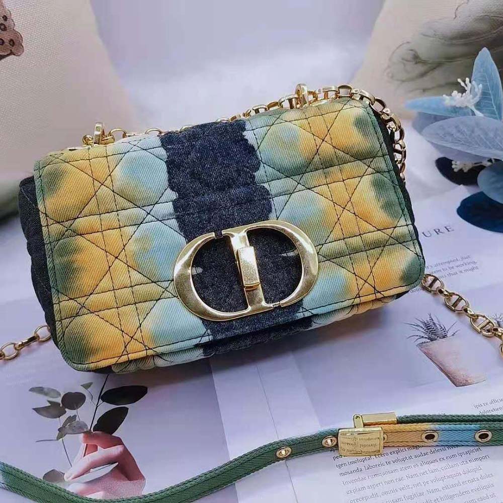Close-up of signature Dior Cannage stitching on green denim bag
