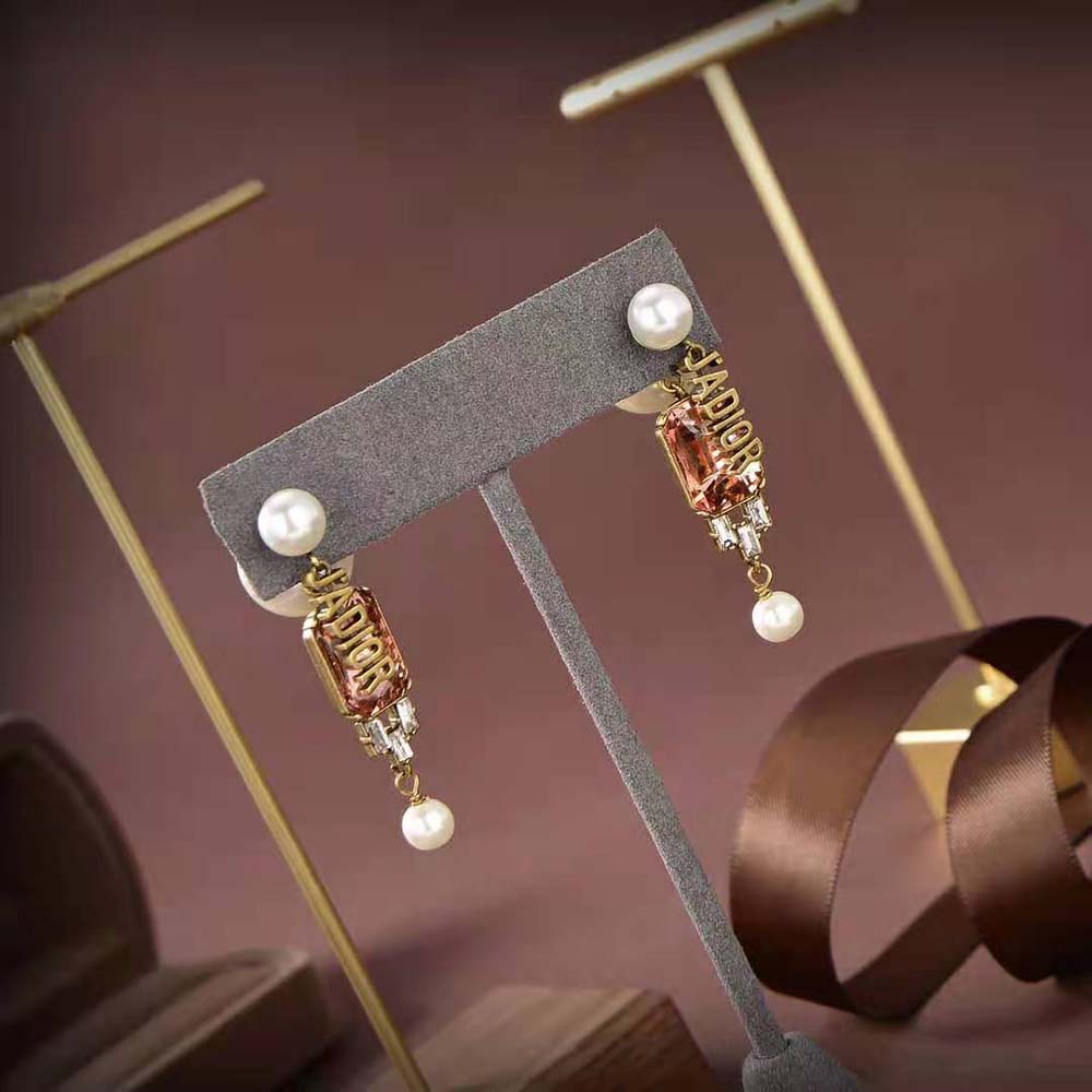 Close-up detail of antique gold finish on Dior Women Tribales Earrings