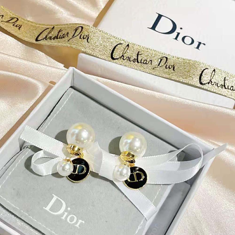 Side angle showing asymmetrical silhouette of Dior Women Tribales earrings