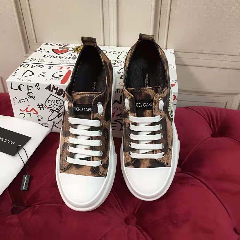 Close-up of DG logo detail on brown cotton drill sneakers by Dolce Gabbana D&G