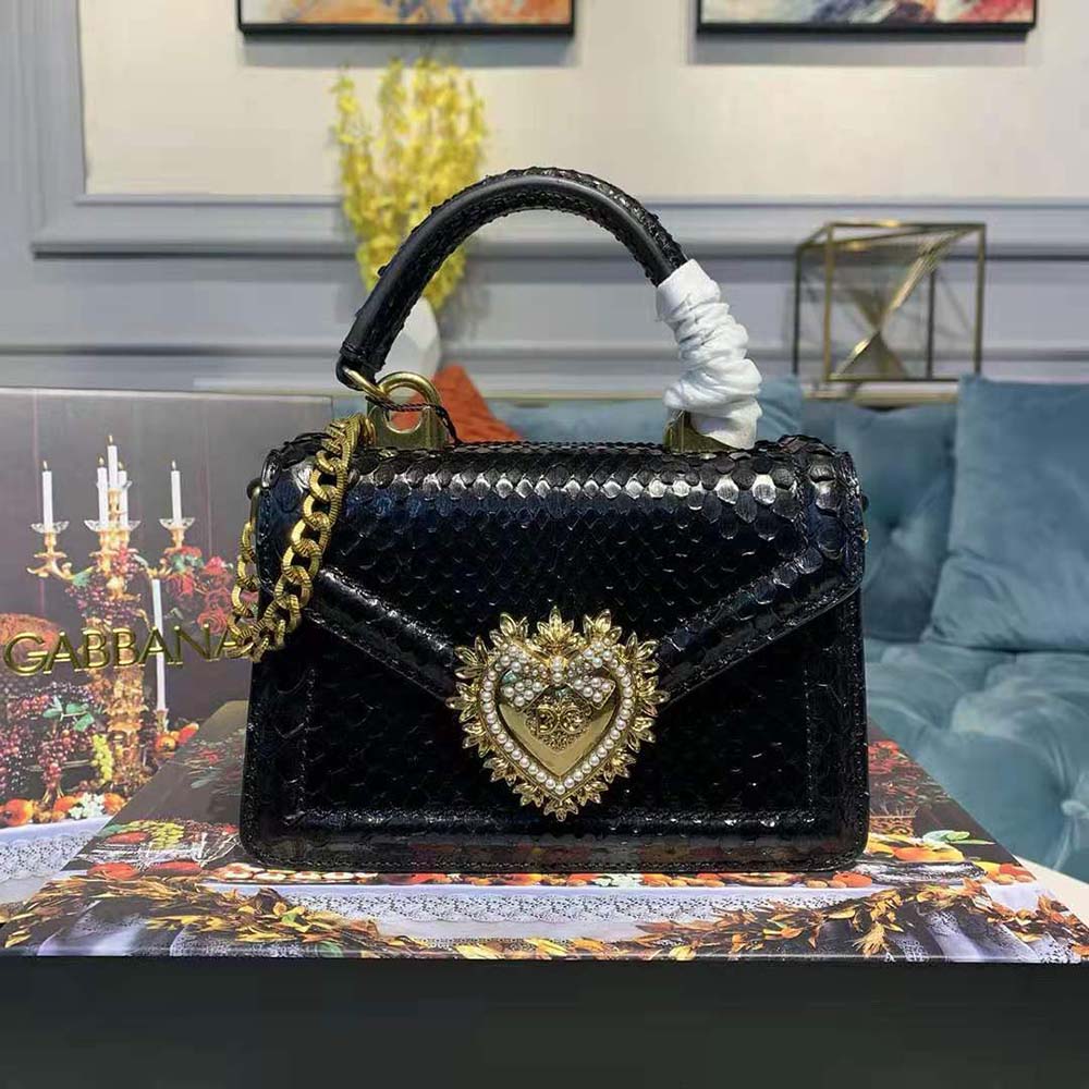 Close-up of gold lion head hardware on Dolce Gabbana D&G Small Devotion Bag