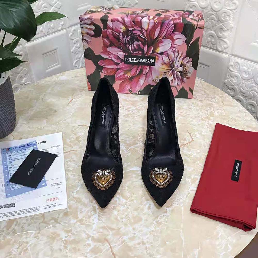 Close-up of black lace and gold heart detail on Dolce Gabbana Taormina pumps