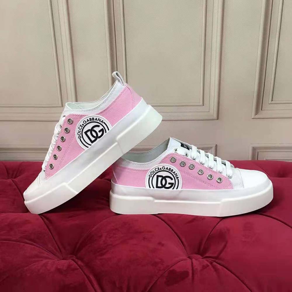 Close-up on DG logo detail on Dolce Gabbana D&G pink canvas sneakers