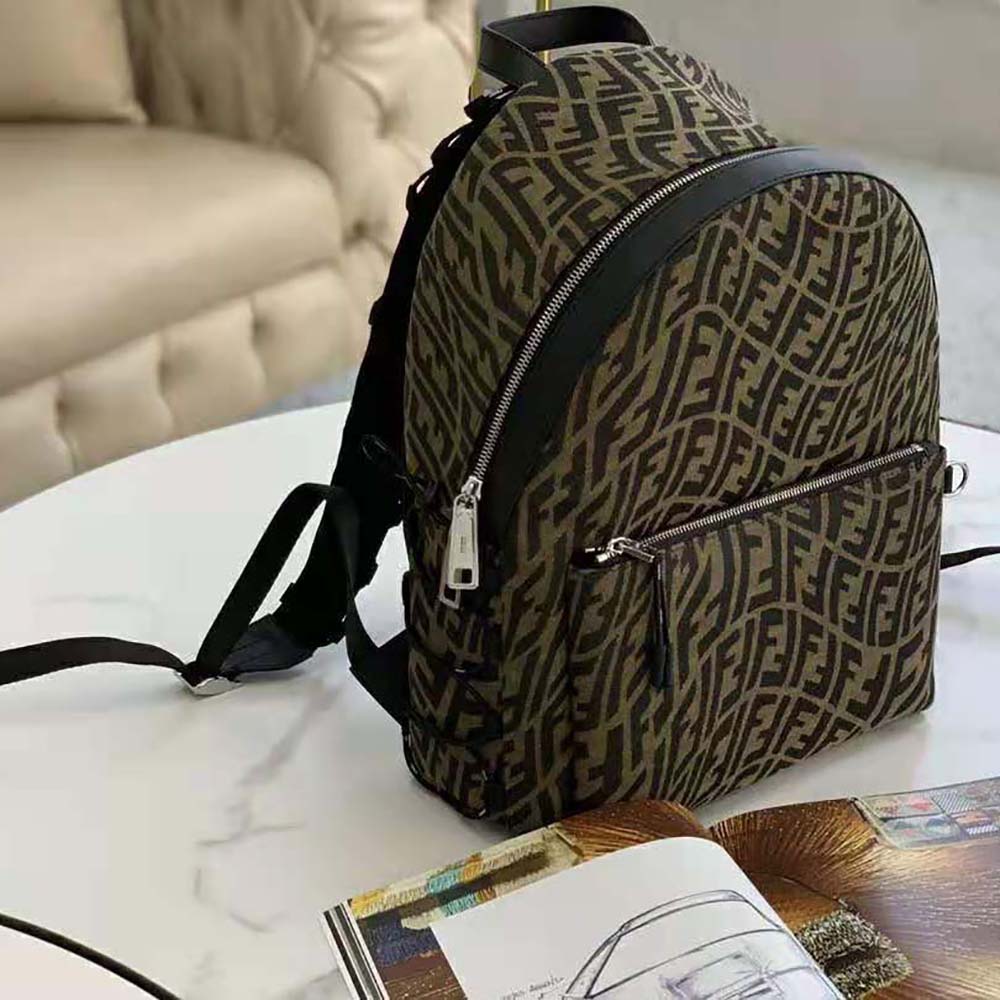 Side profile showing adjustable straps on Fendi Women Backpack in Brown FF Vertigo Fabric