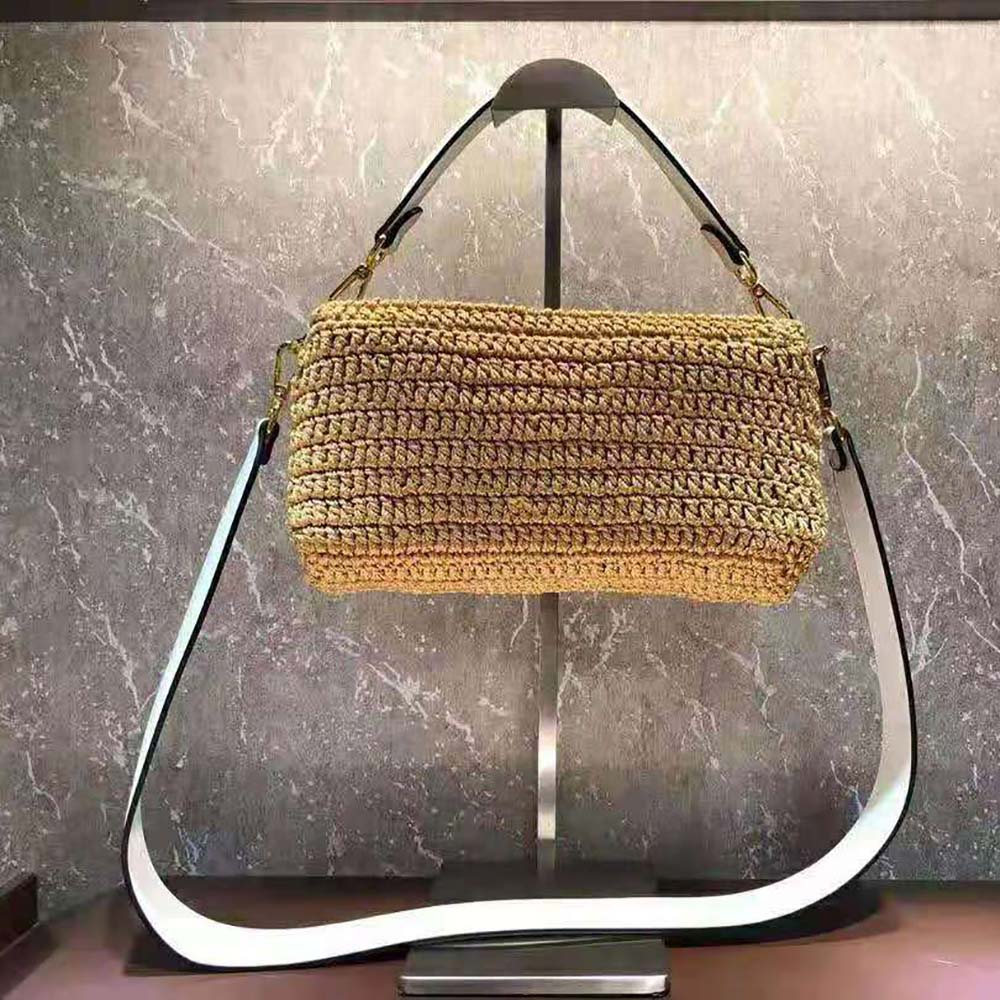 Side angle showing the flap closure and adjustable shoulder strap