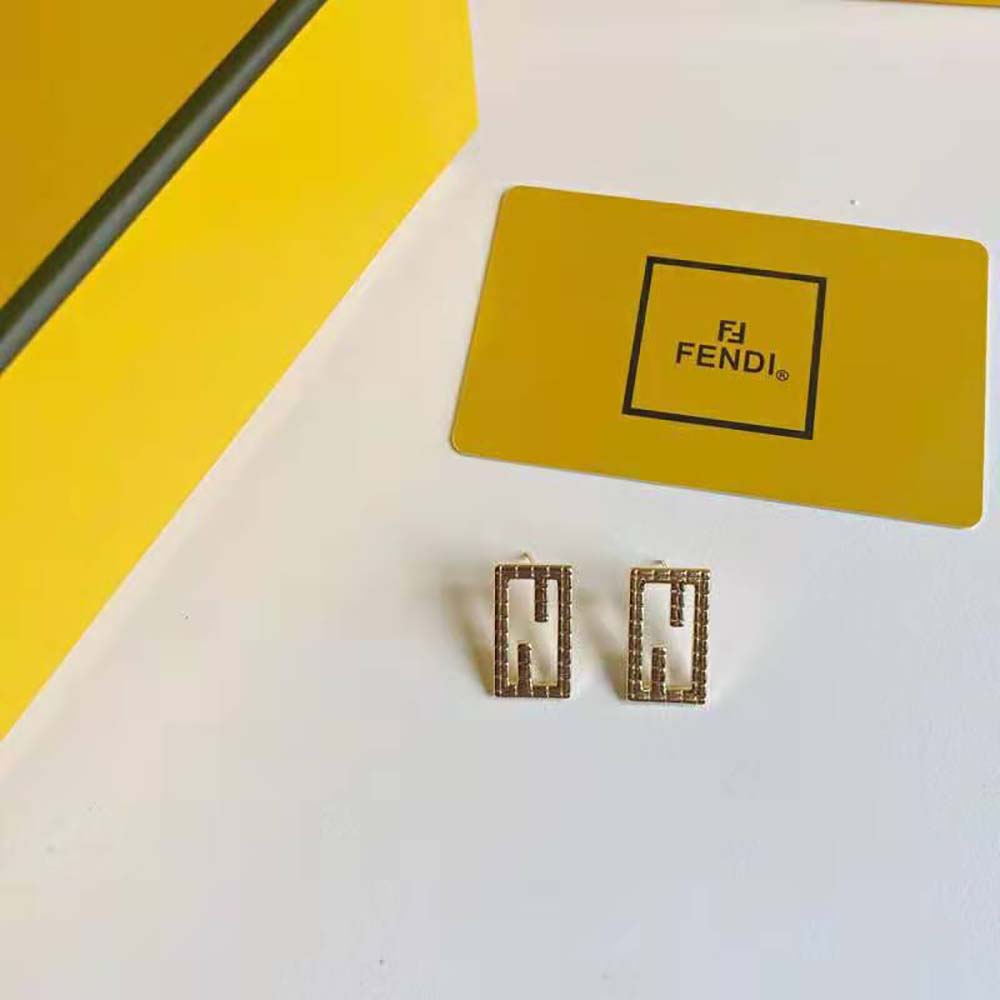 Fendi Women Baguette Gold-color Earrings displayed on model’s ear