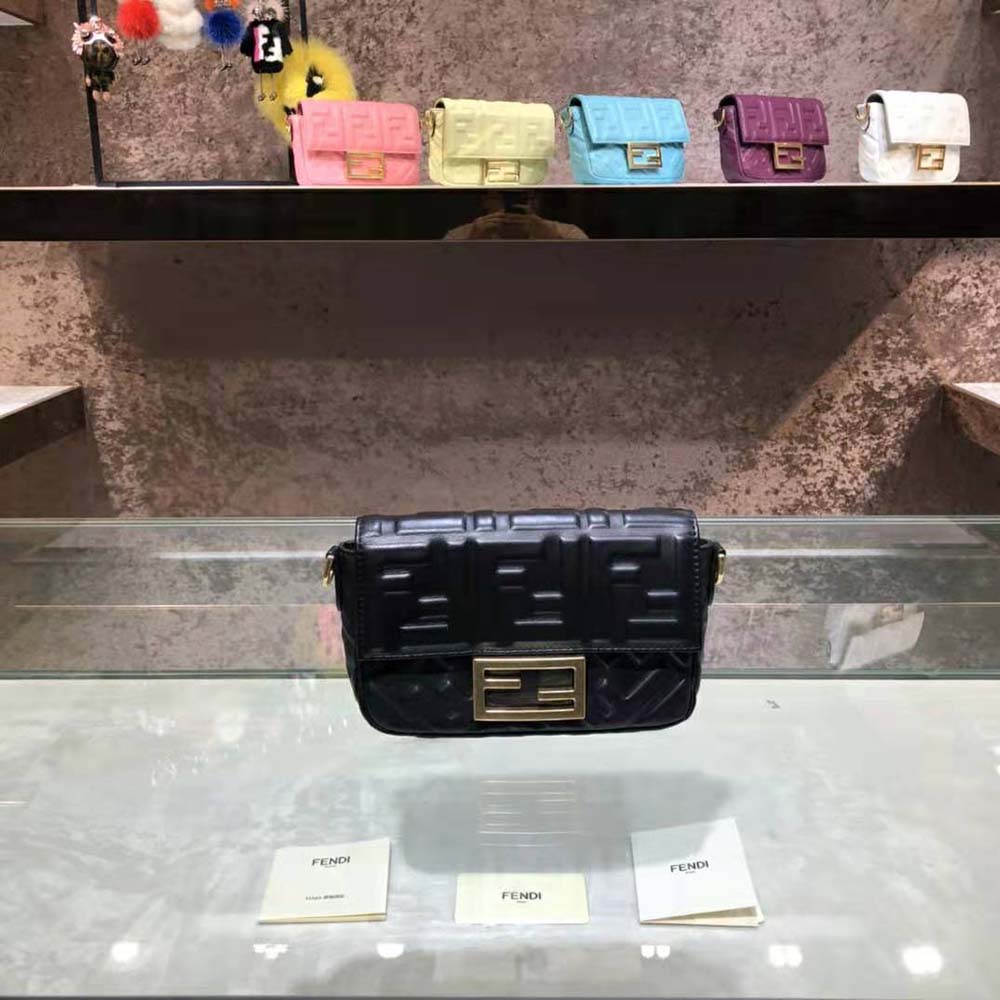 Side angle of Fendi Women Iconic Mini Baguette Black Leather Bag showing compact silhouette