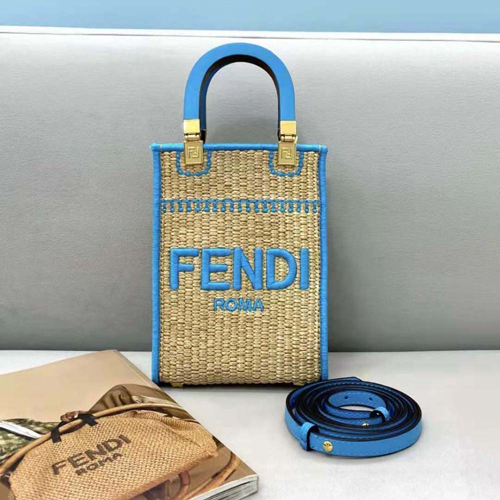 Close-up detail of braided straw and gold hardware on Fendi mini-bag