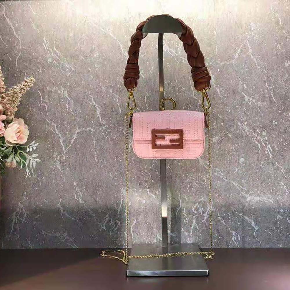 Close-up of gold-tone Fendi logo charm on Nano Baguette Charm Lilac Nylon