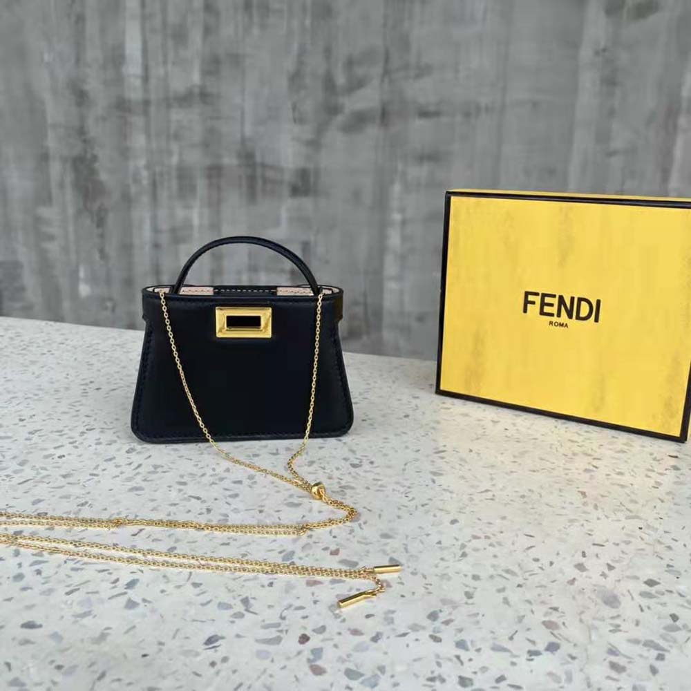 Close-up of gold-tone hardware on Fendi Women Pico Peekaboo Charm Black bag