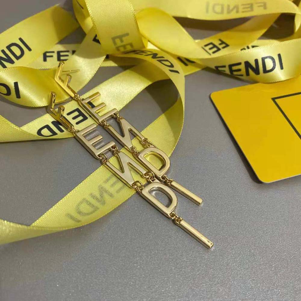 Side angle of Fendi Women Signature Gold-color Earrings highlighting closure