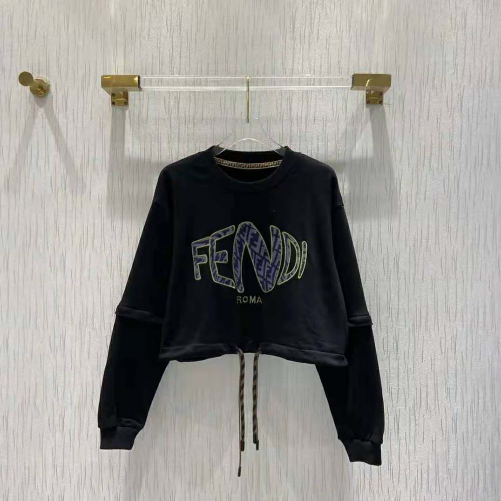 Close-up of ribbed cuff and subtle Fendi logo on sweatshirt