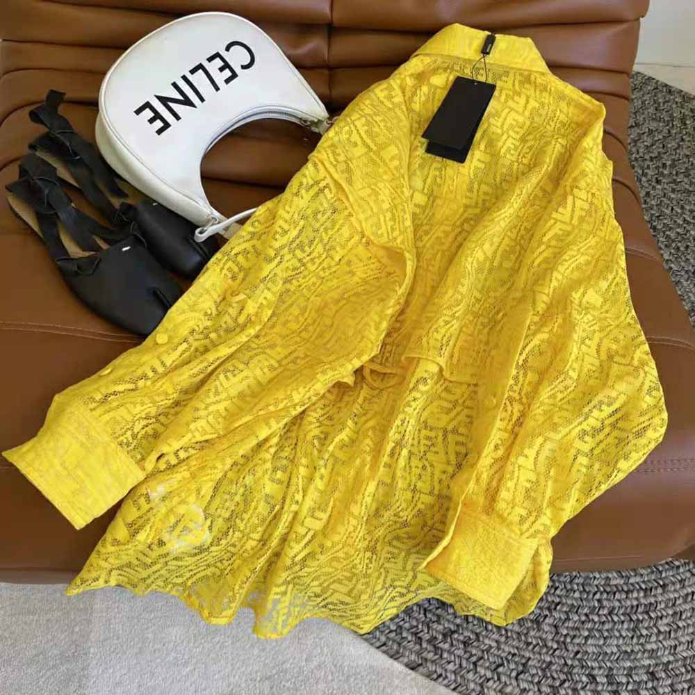 Side angle showing silhouette and airy lace fabric of Fendi Yellow Lace Shirt Dress