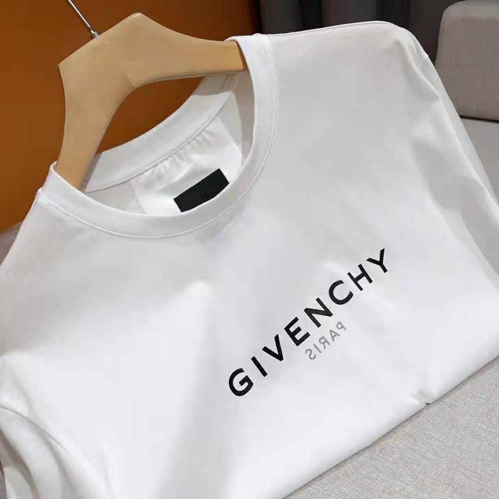 Close-up of Givenchy reverse logo print on white oversized t-shirt