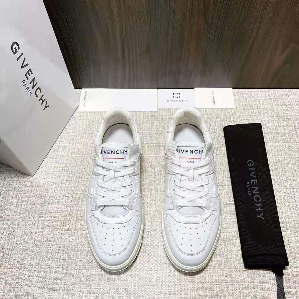 Close-up on wing detail and lace of Givenchy Men Wing Low Sneakers