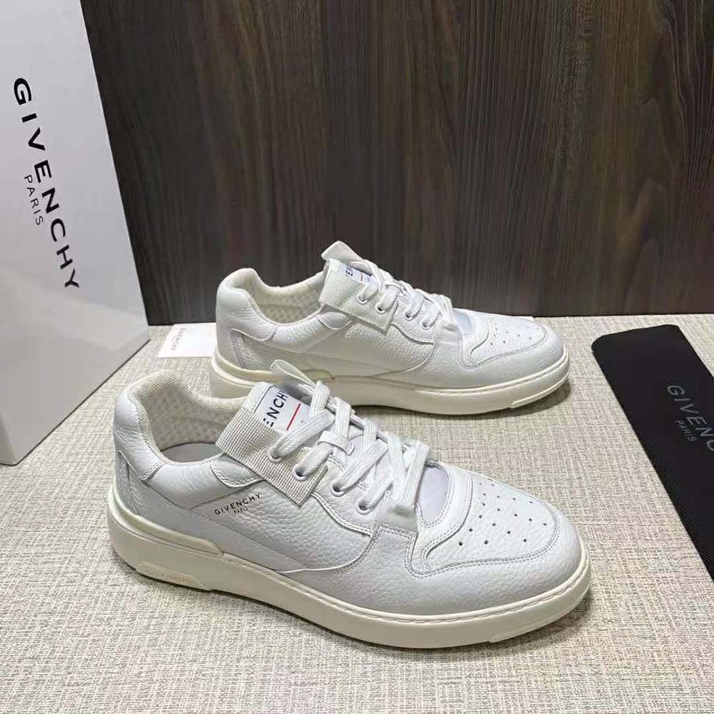 Overhead shot showing white leather texture of Givenchy Men Wing Low Sneakers