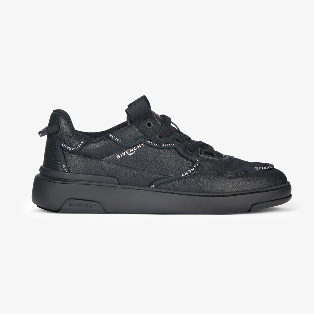 Side view of Givenchy Men Wing Low Sneakers in black leather with piping