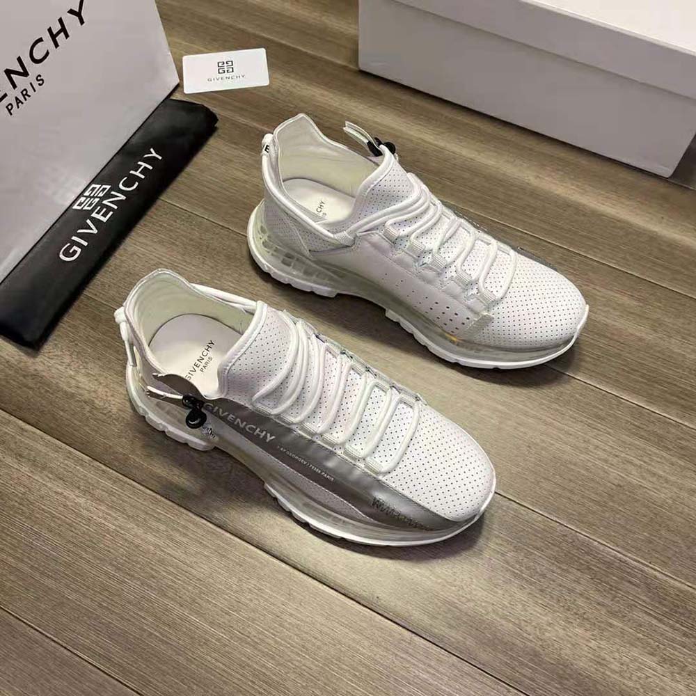 Close-up of zip and embossed hardware on Givenchy Unisex Spectre Low Runners Sneakers