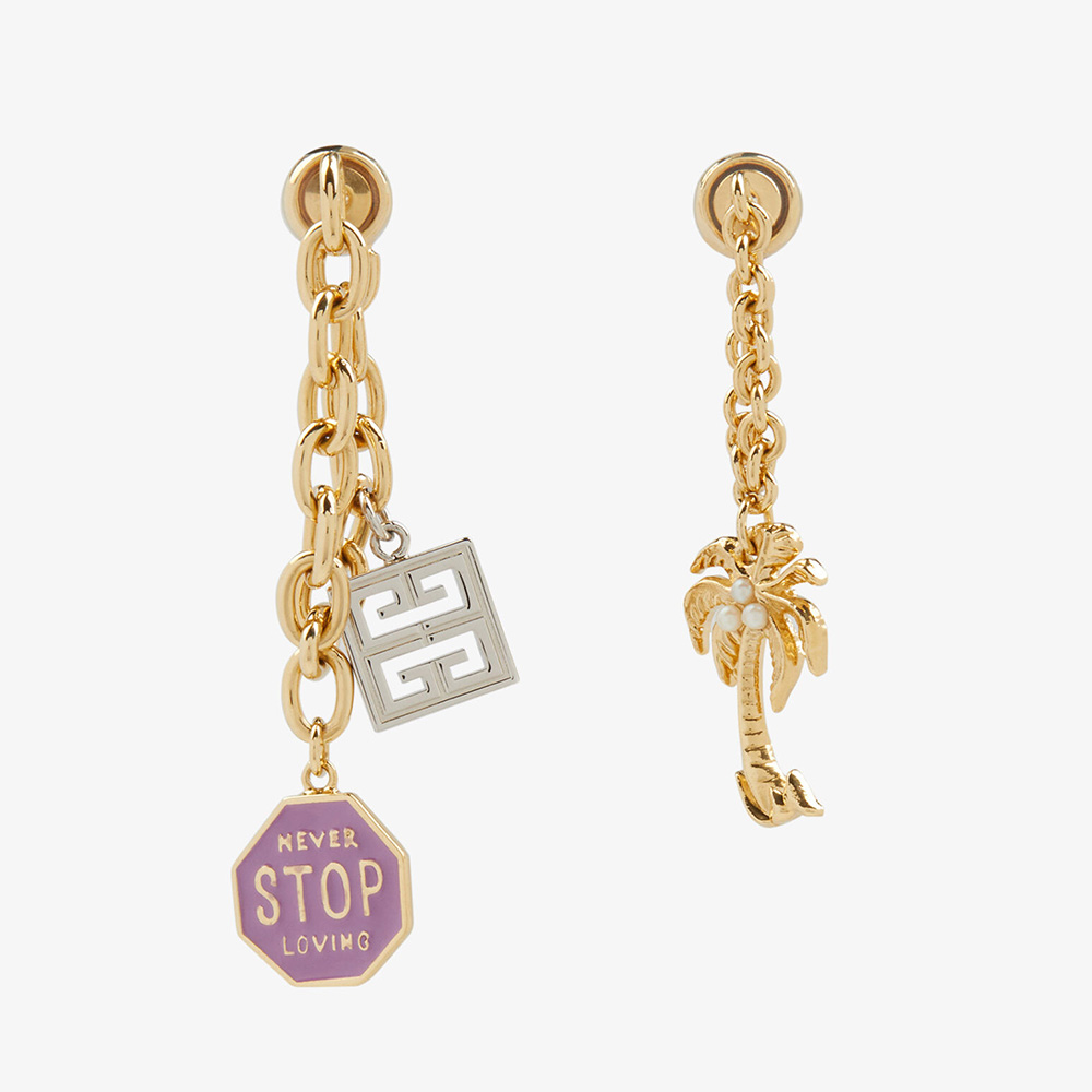 Close-up of Givenchy Women Charms Asymmetrical Earrings gold-tone detail