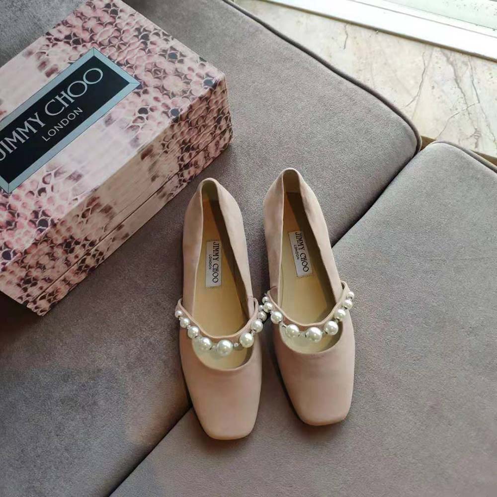 Close-up of pearl embellishment on Jimmy Choo Women Ade Pink Suede Flats