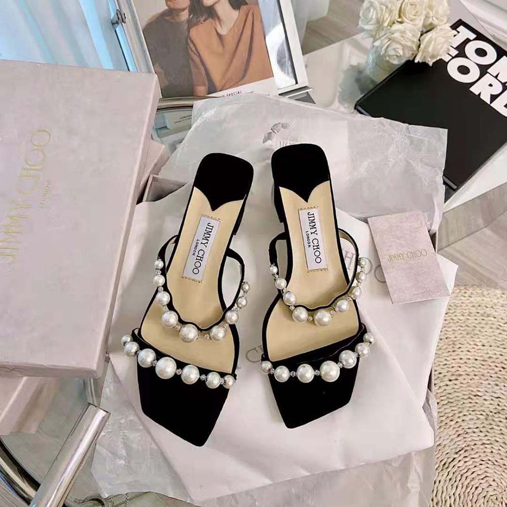 Close-up on pearl embellishment on Jimmy Choo Amara 45 Black Suede Mules