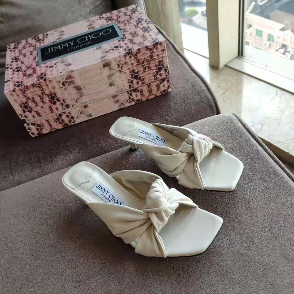 Top down shot showing the elegant silhouette of Jimmy Choo Avenue 50 mules