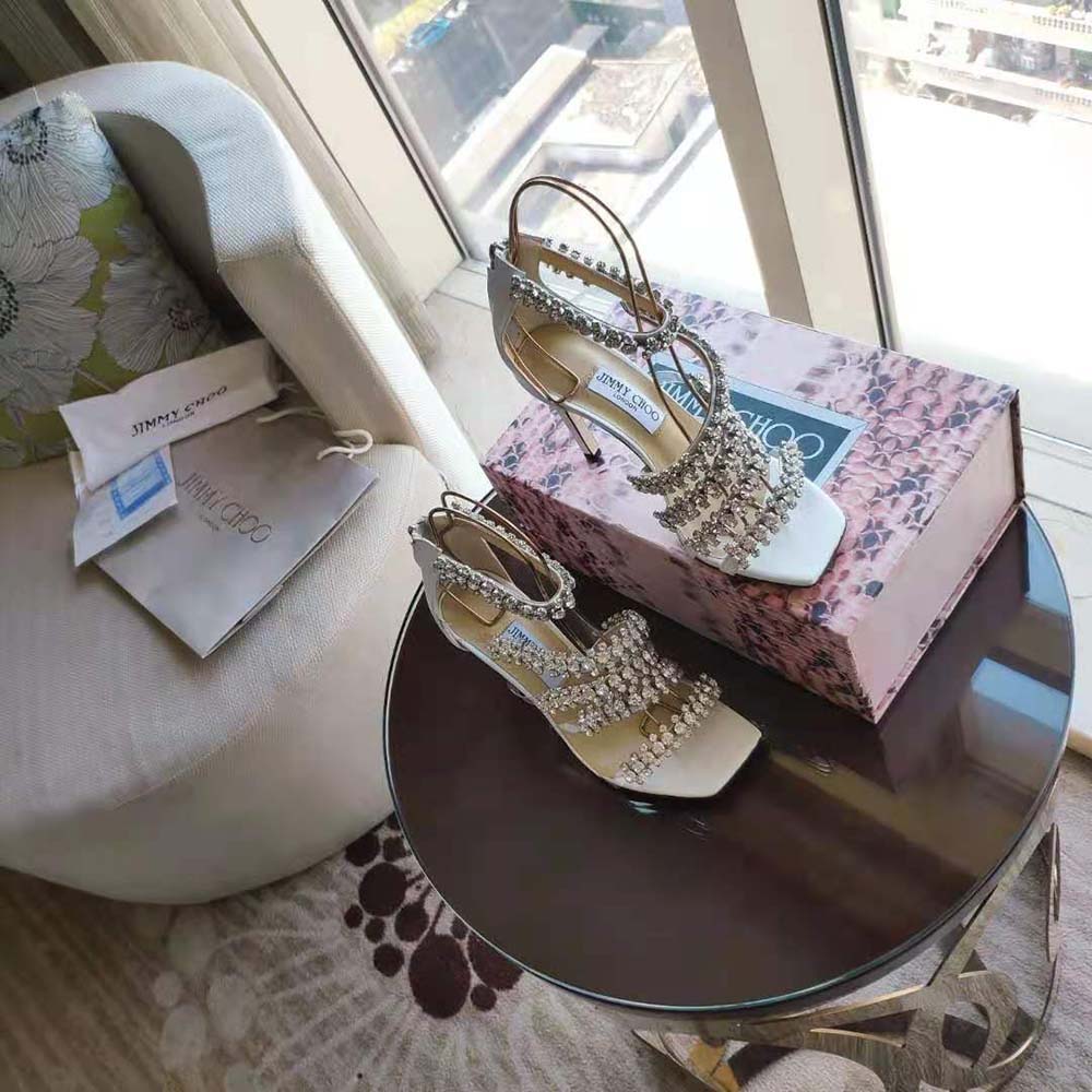 Close-up on crystal detail and white nappa leather of Jimmy Choo Josefine sandals