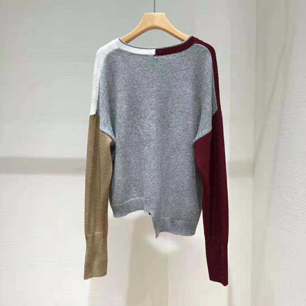 Side angle highlighting asymmetric hem of Loewe Women Anagram Sweater