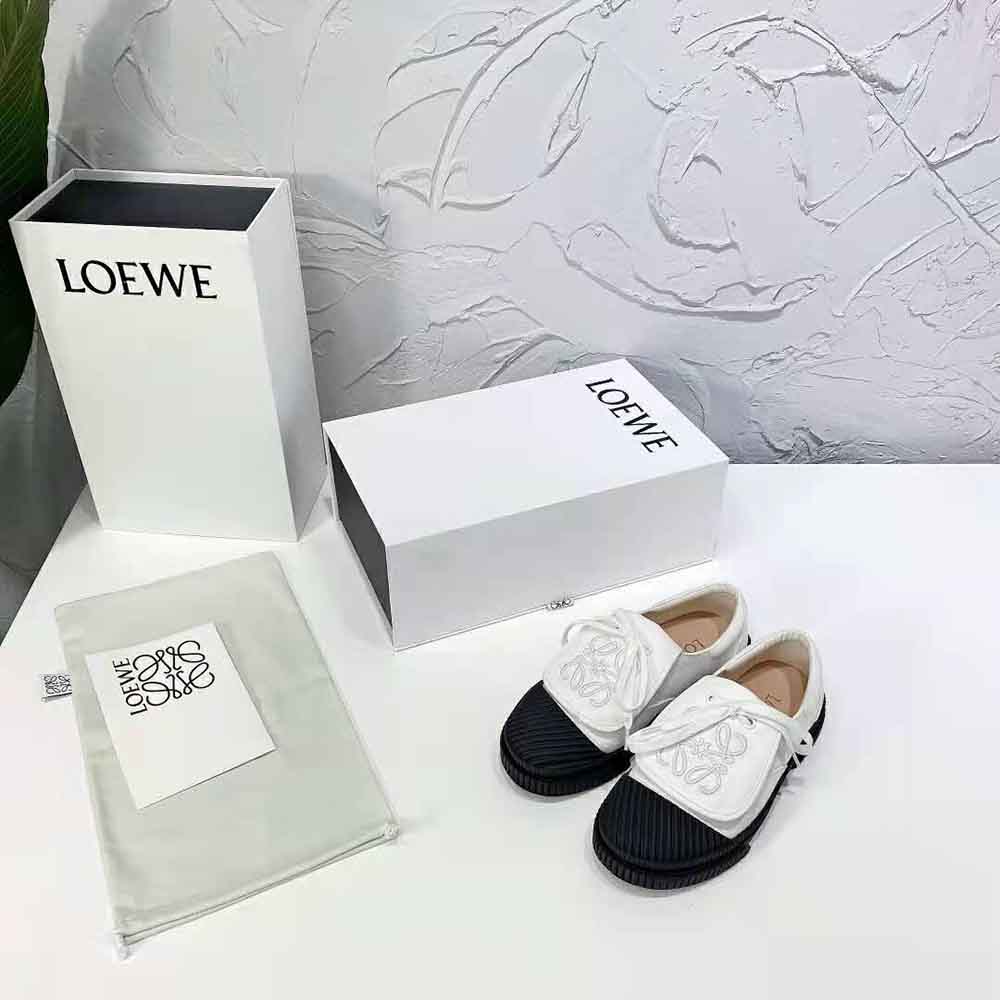 Close-up of embossed Anagram flap detail on Loewe Women Anagram Flap Sneaker