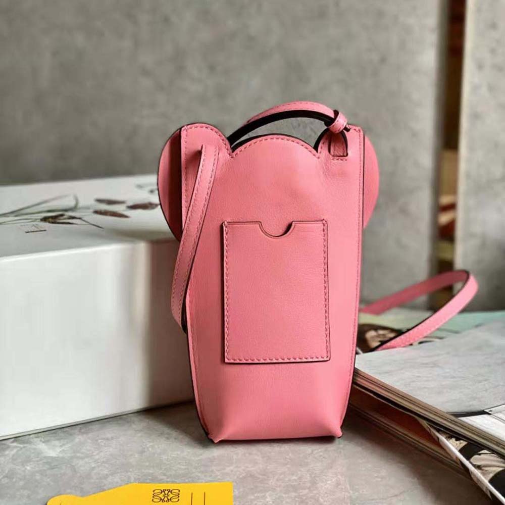 Side angle showing slim silhouette of Loewe Women Elephant Pocket pink shoulder bag