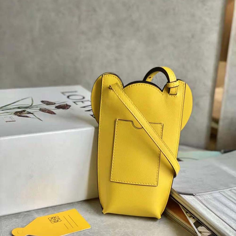 Side angle showing adjustable strap of Loewe Women Elephant Pocket bag
