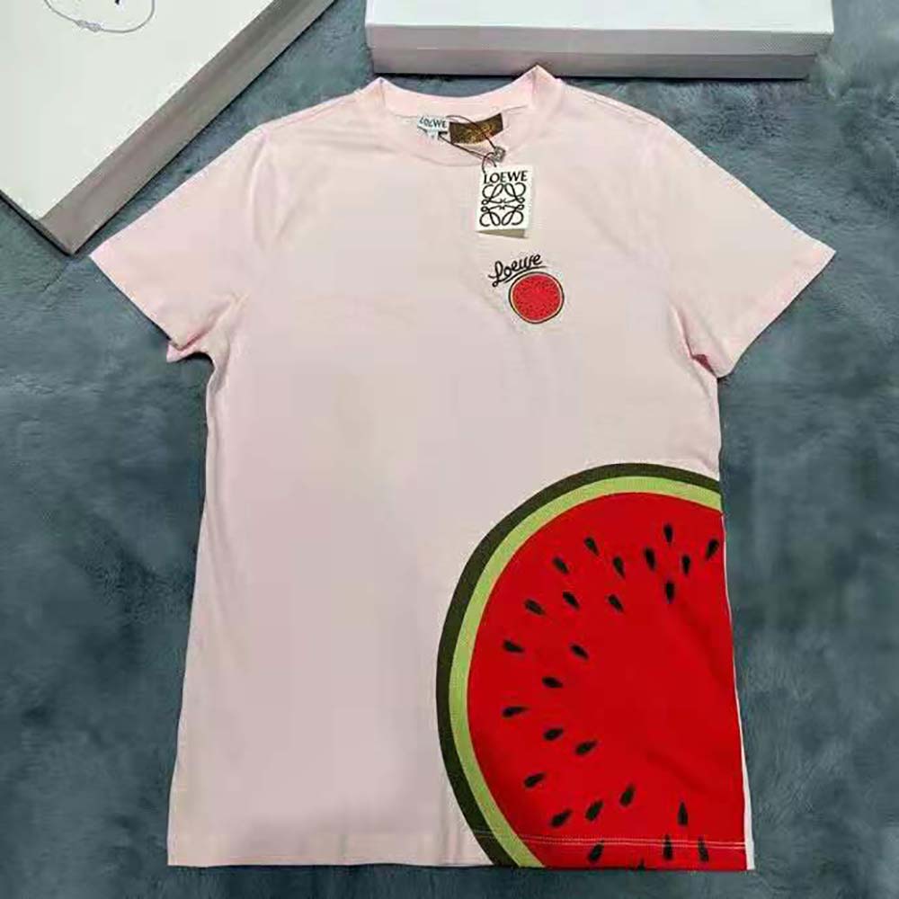 Close-up of pink cotton fabric and Loewe logo detail on T-shirt