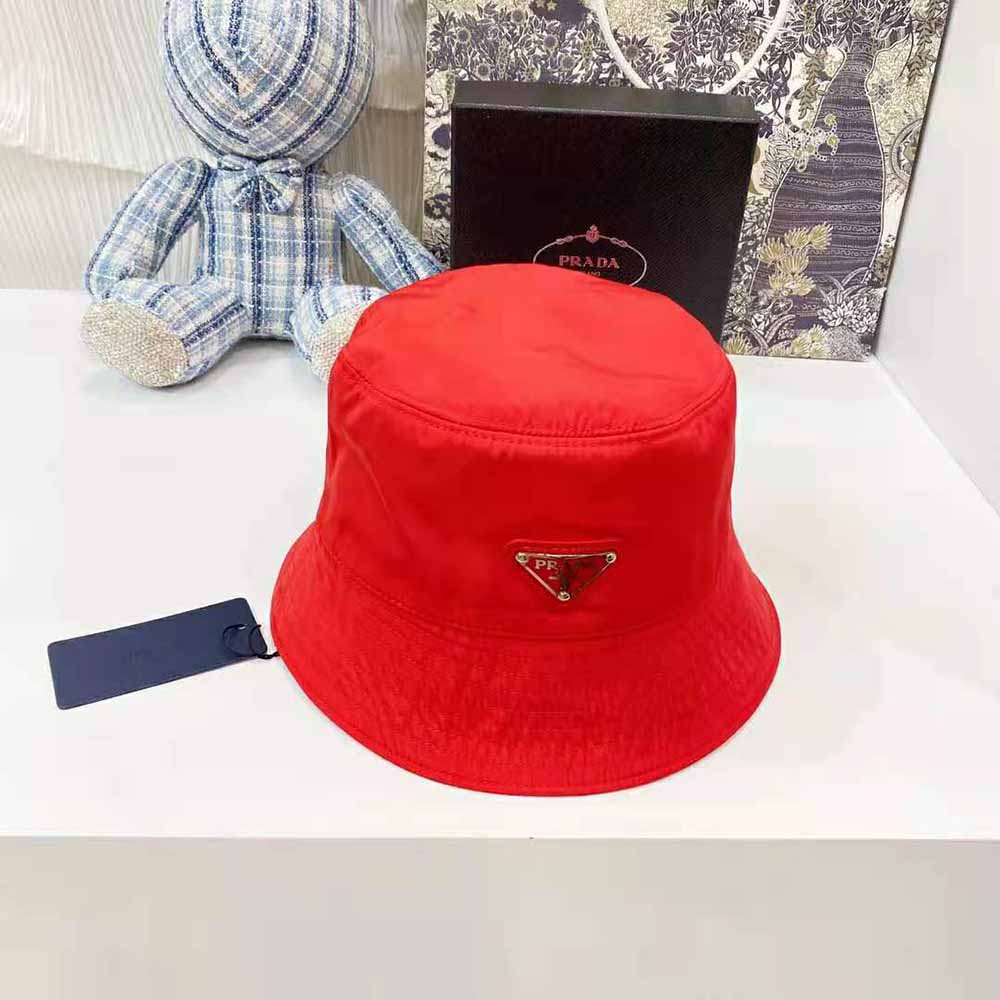 Side angle showing relaxed silhouette of Prada Women Nylon Bucket Hat