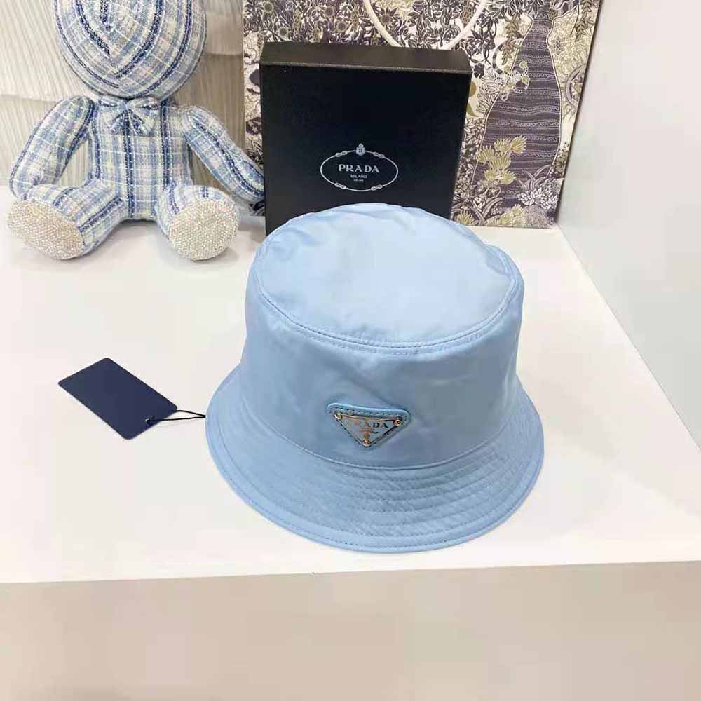 Side angle showing adjustable strap on Prada Women Nylon Bucket Hat in blue