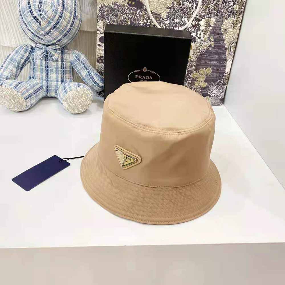 Side profile showing structured brim of Prada Women Nylon Bucket Hat Sandy