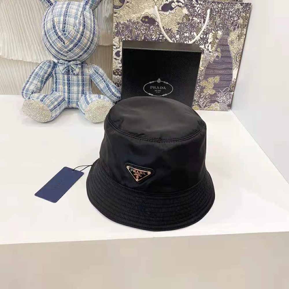 Side angle of Prada Women Nylon Bucket Hat with iconic logo displayed