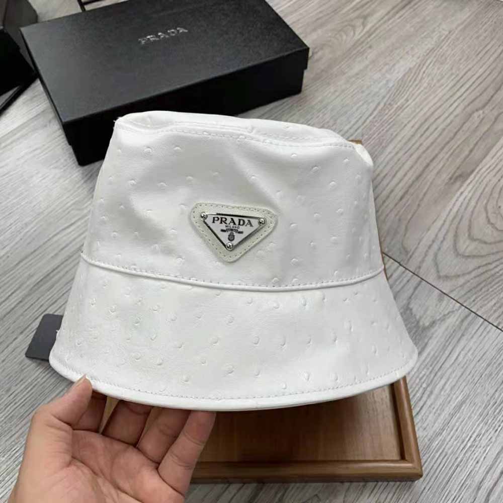 Side angle of Prada Women Ostrich Leather Bucket Hat-White with logo hardware