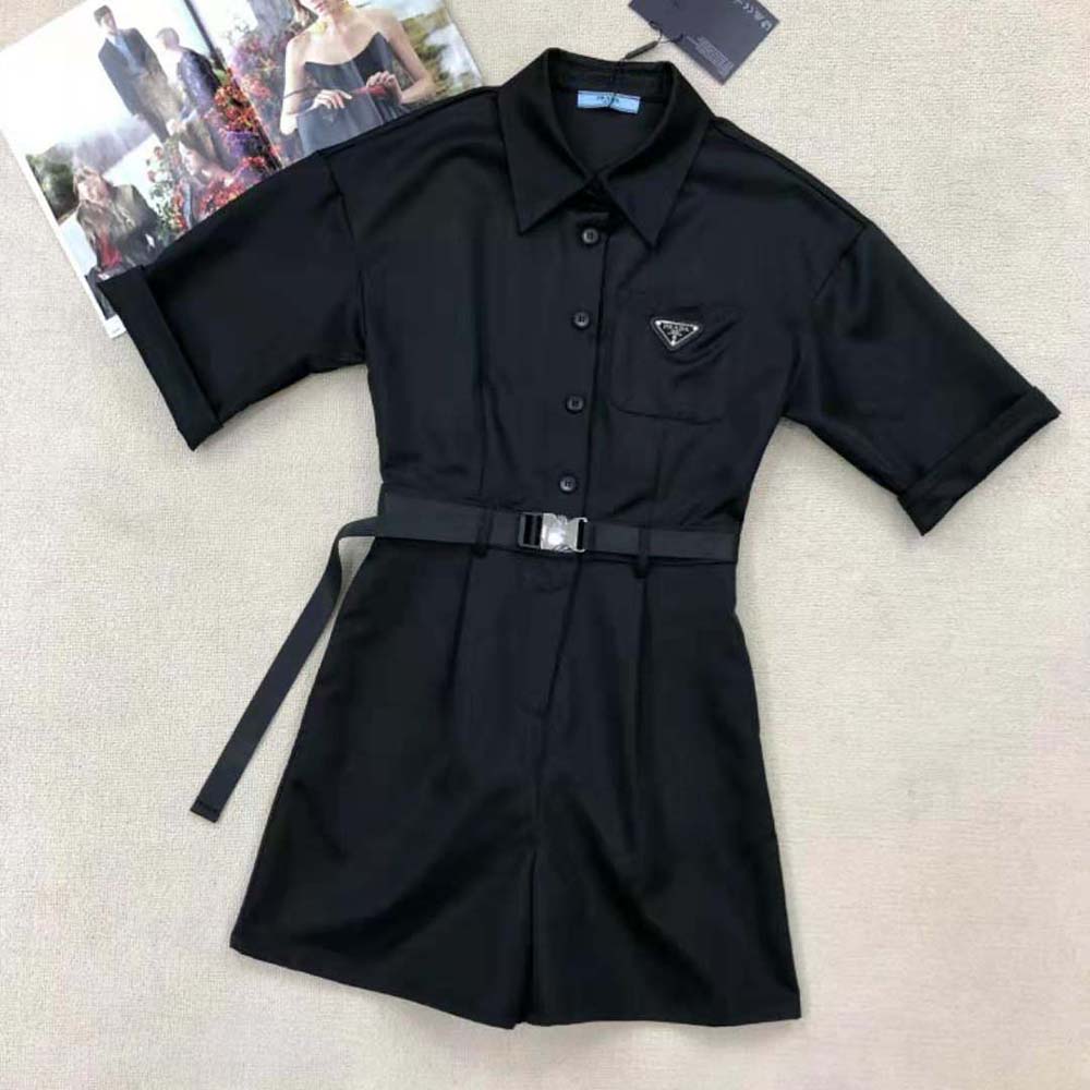Close-up of signature Prada hardware on the Re-Nylon playsuit in black